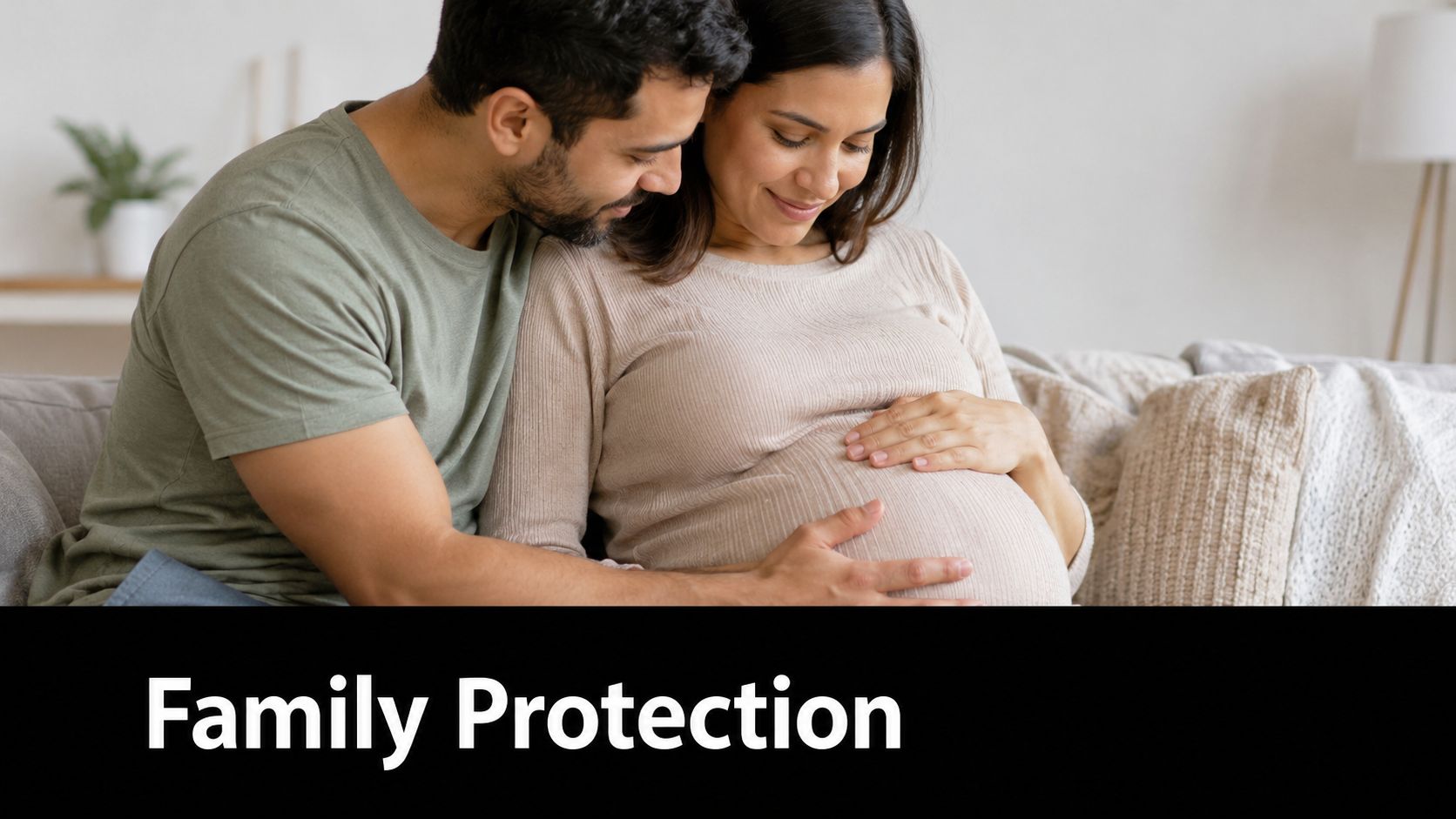 A happy expectant couple resting on a sofa, focusing on the future and safety of their growing family.