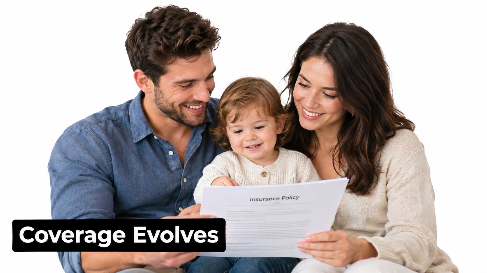 A happy young family with a toddler sitting together and looking at an insurance policy document.